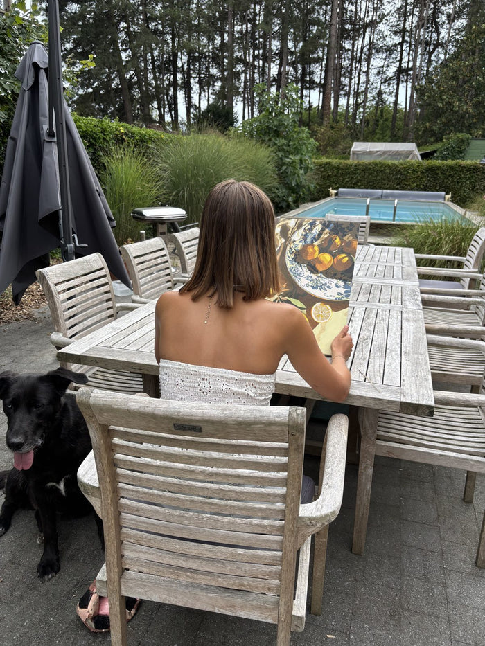 Painting outdoors on a terrace by the pool