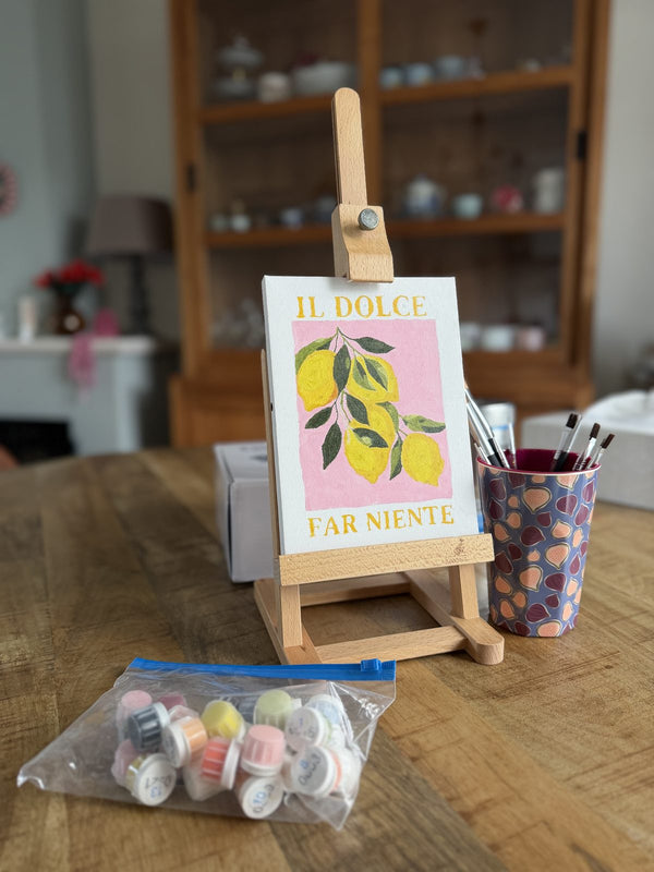 Everything in the kit: easel, canvas, brushes and numbered paints